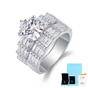 Detail of 3ct round Moissanite ring set with baguette side stones and GRA certificate