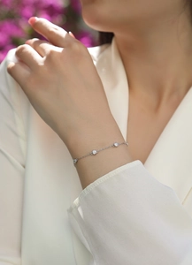 Detail of S925 sterling silver bubble bracelet with Moissanite on a female wrist