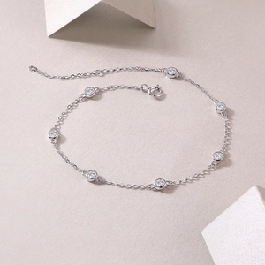 Detailed view of S925 silver bubble bracelet with bezel-set round moissanite stones