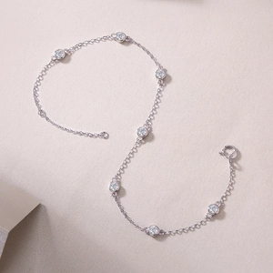 Macro detail of S925 sterling silver bubble bracelet with bezel set moissanite stones
