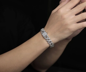 Close-up of iced out moissanite cuban link bracelet in S925 silver finish on wrist