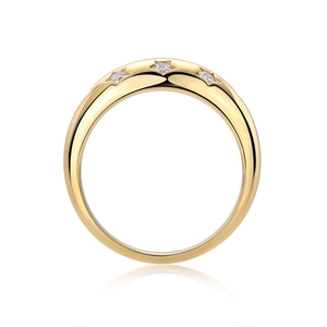 Detail of three sparkling moissanite stones set in star engravings on a gold-plated silver ring