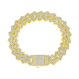Close-up of hip hop gold Cuban link bracelet with rectangle pavé-set moissanite stones