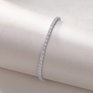 Macro detail of S925 silver moissanite tennis bracelet on a minimalist display stand