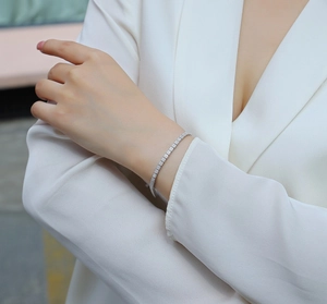 Close-up of S925 sterling silver tennis bracelet with moissanite on a model wrist