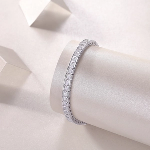 S925 sterling silver tennis bracelet with square-cut moissanite stones on a pedestal