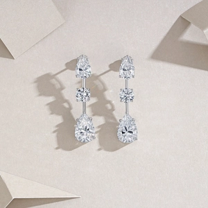 Exquisite S925 sterling silver drop earrings featuring triple pear and round cut moissanite stones