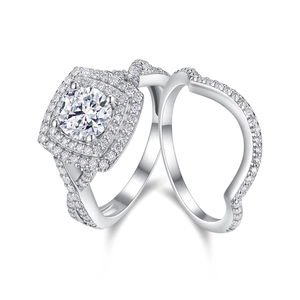 Detail of 925 sterling silver halo ring set with round moissanite and twisted band