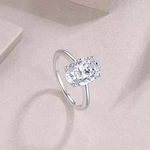 Macro detail of S925 sterling silver stamp and oval-cut moissanite stone in four-prong setting