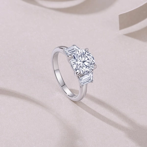 S925 sterling silver three-stone ring with round moissanite and tapered side baguettes