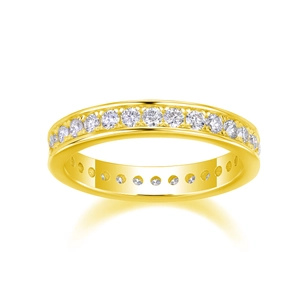 Macro view of gold eternity ring with circular brilliant cut moissanite stones