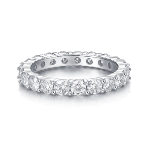 Macro view of full eternity band with round cut moissanite set in polished 925 silver