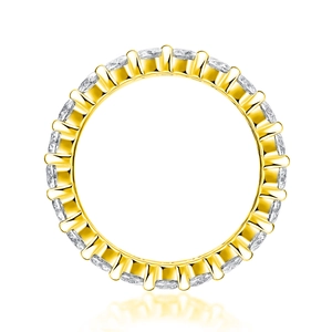 Detail of 18K gold eternity ring with round brilliant cut moissanite stones in claw setting