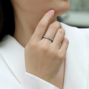 Elegant S925 sterling silver channel set moissanite ring worn on model hand