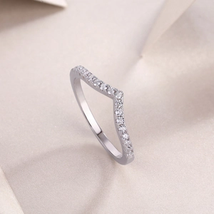 Detailed macro view of V-shaped S925 silver ring with sparkling moissanite pavé stones