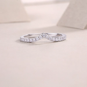 Macro view of V-shaped S925 sterling silver ring featuring a pavé-set moissanite band