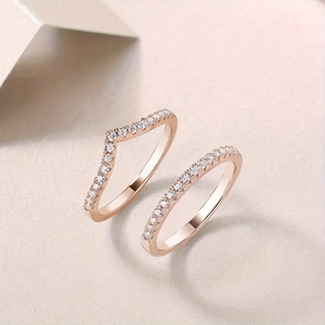 Detail of rose gold plated S925 sterling silver V-shape and half-eternity moissanite rings