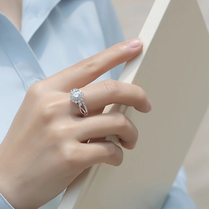 Luxurious S925 silver moissanite ring featuring a flower cluster setting on model's hand