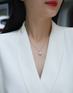Detailed view of square halo lab-grown diamond pendant necklace on model neck