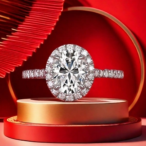 Macro shot of oval cut moissanite ring with halo setting on festive display