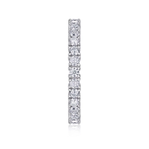Macro shot of S925 silver eternity ring with prong-set moissanite sparkling stones