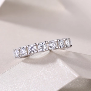 Macro detail of S925 sterling silver ring with seven prong-set moissanite stones