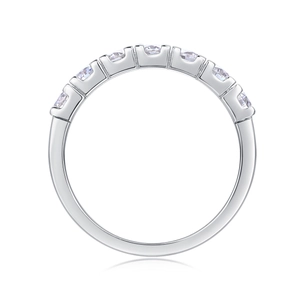 Detail view of 7 round-cut moissanite stones in a S925 sterling silver half-eternity ring