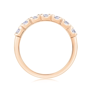 Detail of rose gold plated S925 sterling silver ring with seven prong-set moissanite stones