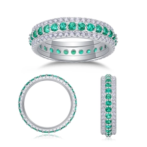 Macro view of S925 sterling silver eternity ring with three rows of emerald and diamonds