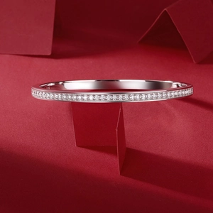 Detail view of S925 sterling silver bangle with micro-pave moissanite and hallmark