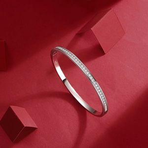 Detailed close-up of S925 sterling silver bangle featuring a row of pavé set white zirconias