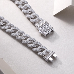 Detailed close-up of a sparkling moissanite cuban link bracelet with a secure diamond clasp