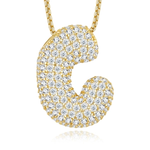 Macro detail of gold S925 silver necklace with sparkling C-shaped moissanite pendant