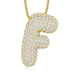 Macro shot of gold-plated S925 silver letter F pendant with Moissanite stones