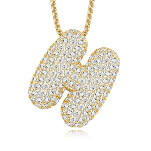 Macro shot of 18K gold letter N pendant with pavé-set moissanite on a polished chain