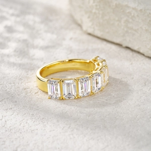 Macro view of gold plated S925 silver ring with emerald cut moissanite stones