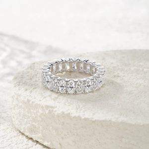 S925 sterling silver eternity ring with oval cut moissanite stones on stone base
