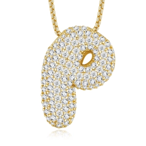 Detail of gold-plated letter P pendant with sparkling cubic zirconia on a box chain