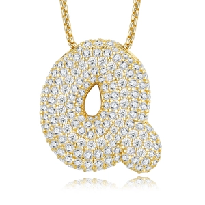 Macro shot of 18K gold plated S925 silver letter Q pendant with pavé D-color moissanite