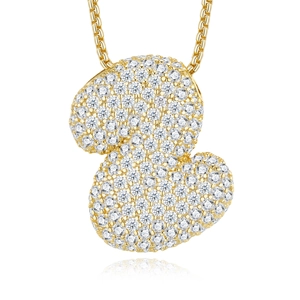 Macro shot of a cartoon duck pendant encrusted with sparkling Moissanite on a gold chain