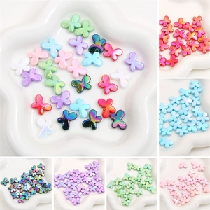 Detailed macro view of colorful butterfly acrylic beads for DIY jewelry and crafts