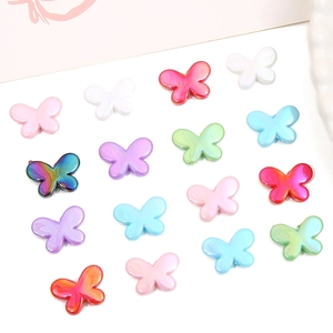 Macro view of colorful acrylic butterfly beads with pearl luster for DIY jewelry making