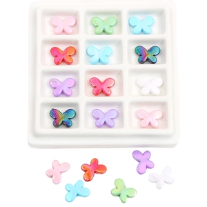 Macro detail of colorful acrylic butterfly beads with iridescent plating for DIY jewelry