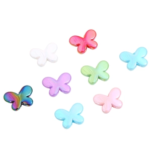 Detail of butterfly-shaped acrylic beads with pearlescent and colorful metallic finishes