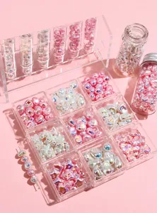 Detailed macro shot of iridescent irregular ABS pearl beads in star and heart shapes