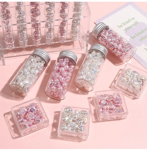 Detailed macro view of colorful pearlescent star and heart beads for DIY jewelry making