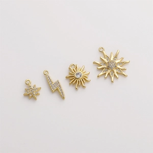 Set of four 14K gold plated zircon pendants with sun, star and lightning bolt shapes