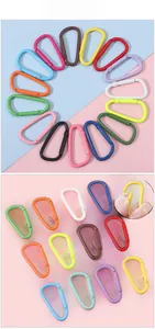 Close-up of assorted colorful D-ring aluminum carabiners with spring snap mechanisms