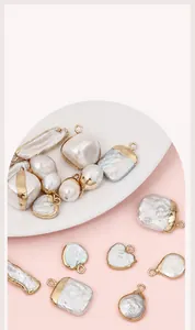 Detail of irregular baroque freshwater pearls with gold-plated edges and metal jump rings