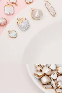 Macro shot of baroque freshwater pearls with gold plated edges for DIY jewelry making
